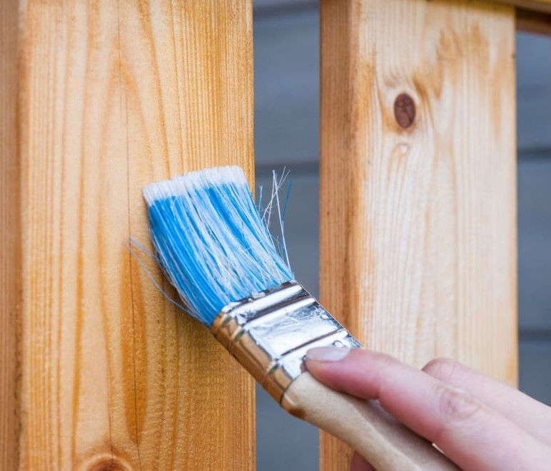 Applying a protective waterproof treatment to wood